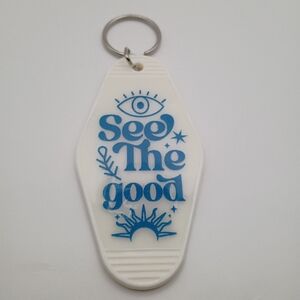 Vintage Style White Motel Keychain with Blue Inspirational Text